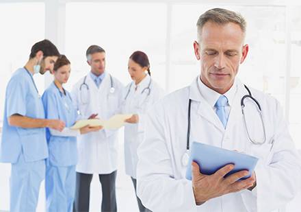 doctor holding tablet