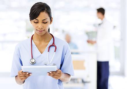 nurse holding tablet